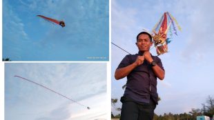 Salah seorang pengunjung yang bersua foto bersama layang-layang Naga Milik Ajis